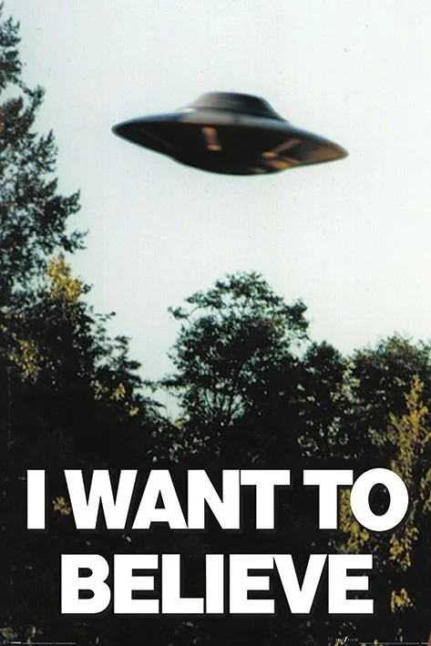 A flying saucer over trees and the text "I Want To Believe", from the X-Files TV show (a poster designed by Chris Carter inspired by artist Ed Ruscha)